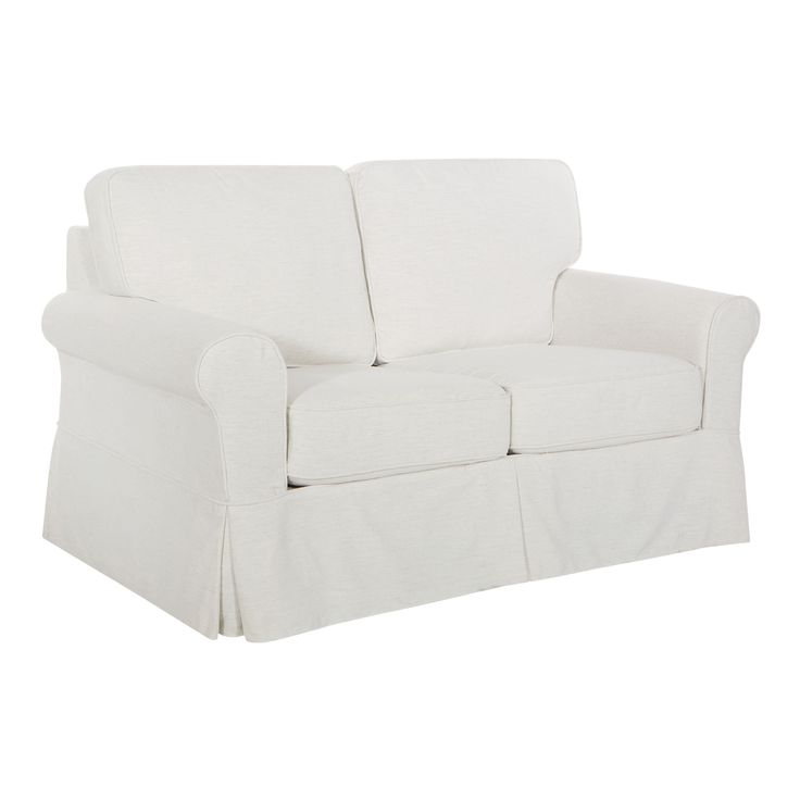 a white couch sitting on top of a white floor