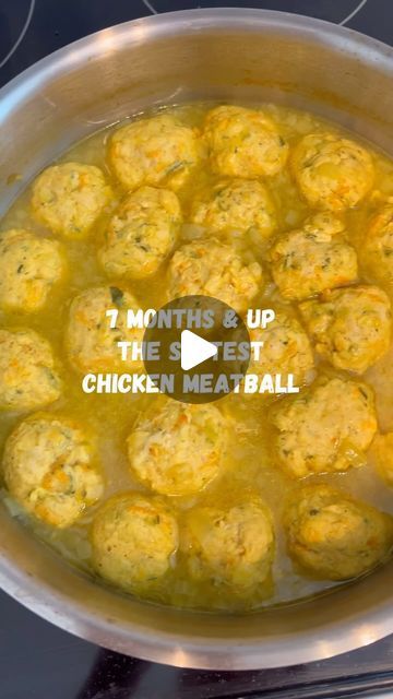 chicken meatballs cooking in a pot on the stove