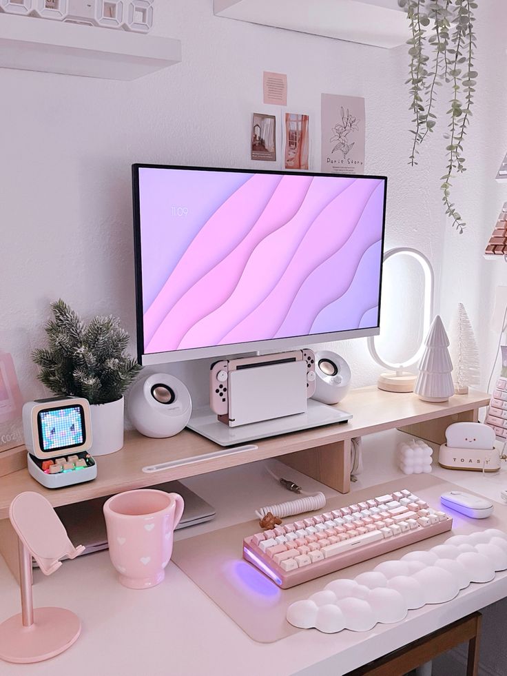 a computer monitor sitting on top of a wooden desk next to a keyboard and mouse