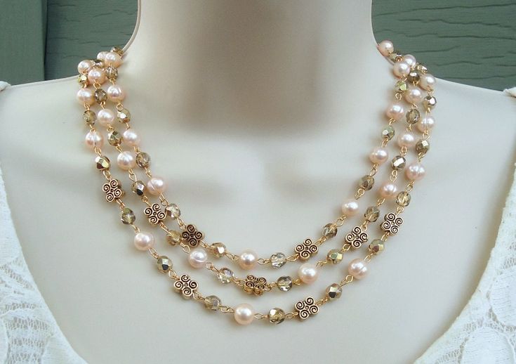 "This is a statement necklace. You really can't go wrong with this classic pearl necklace. It is so elegant and versatile, perfect for all seasons. This stunning triple-strand necklace combines beautiful freshwater pearls with crystals. This piece is finished with a simple lobster claw closure and has my signature logo tag. This necklace measures 16\" in length with a 2\"extension. This necklace is classic, feminine and eye-catching, Perfect for a bride that wants to make a statement or anyone t Elegant Cream Double Strand Necklaces, Elegant Double Strand Cream Necklace, Elegant Cream Double Strand Necklace, Collar Rosa, Classic Pearl Necklace, Diy Collier, Tiffany Jewelry, Necklace Crystal, Pearl Pendant Necklace