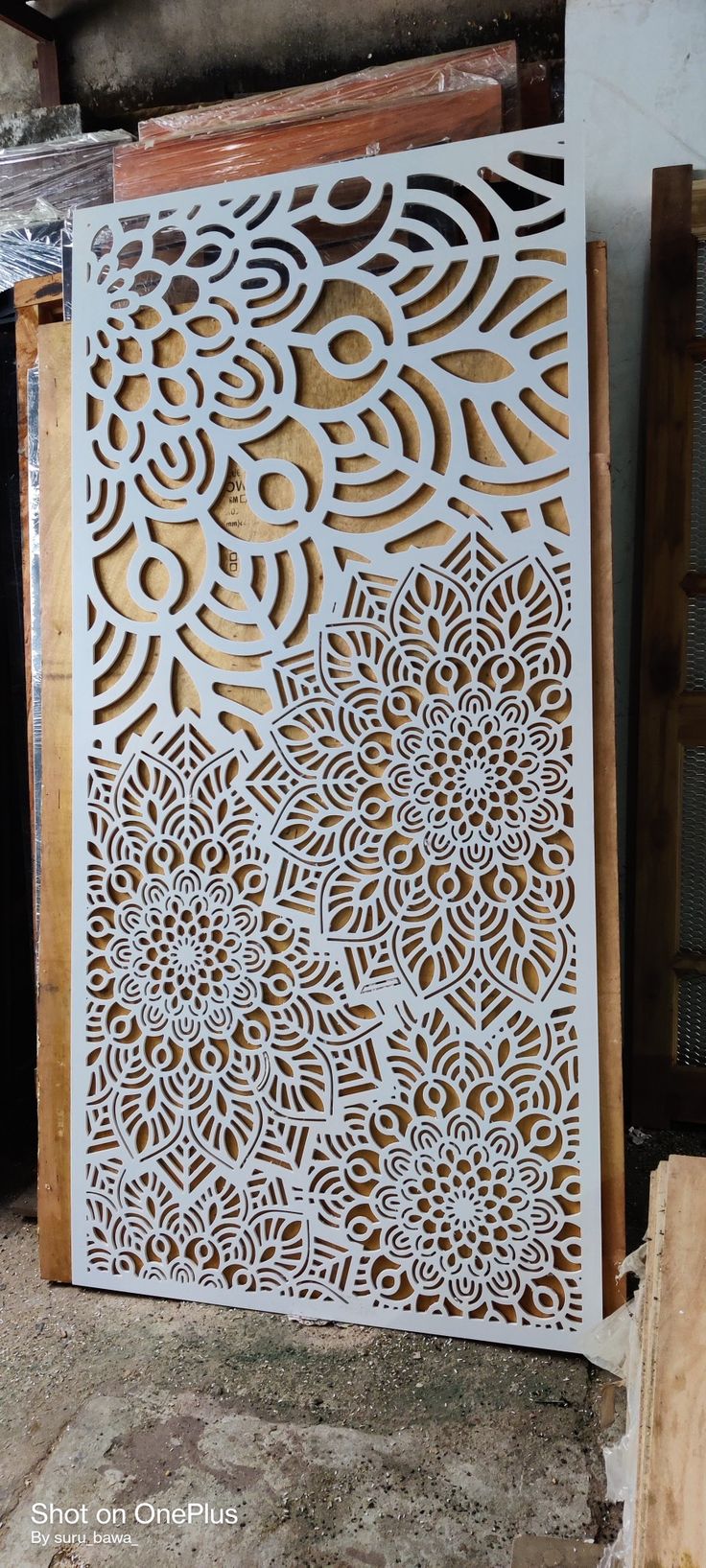 an intricate laser cut design on the side of a wall in a building under construction