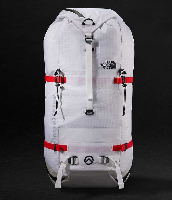 the north face back pack in white with red straps and zippers on both sides