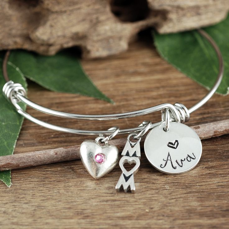 Take a LOOK at our Website: ANNIEREH.com Looking for that perfect gift for Mom? See our personalized Custom Mom Bracelet with her children's Names. Details for Bracelet: * Stainless Steel Bangle * Pewter Heart with Birthstone for MOM * MOM Pendant * ONE Name added to represent each Child. More names can be added during check out. (price will adjust automatically) How to order: 1. Select the number of names (let us know the name in the note to seller box) at check out Thank you for shopping! Anni Adjustable Stainless Steel Heart Bracelet As Gift, Stainless Steel Bangle Bracelet For Valentine's Day, Adjustable Metal Bracelet For Valentine's Day, Adjustable Metal Bracelets For Valentine's Day, Adjustable Engraved Bracelets For Birthday Gift, Engraved Adjustable Bracelets For Birthday Gift, Heart Charm Bangle Bracelets For Friendship, Friendship Metal Bracelets For Valentine's Day, Adjustable Metal Charm Bracelet For Valentine's Day