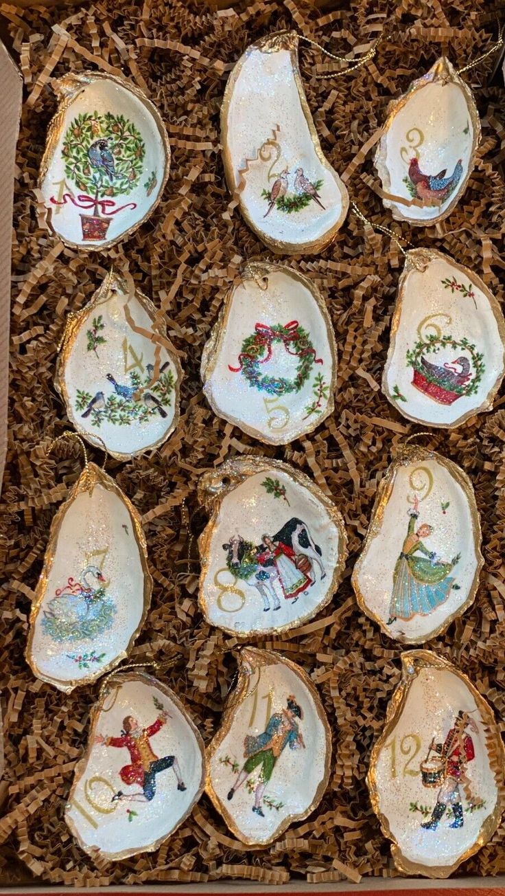 twelve porcelain christmas ornaments in a box