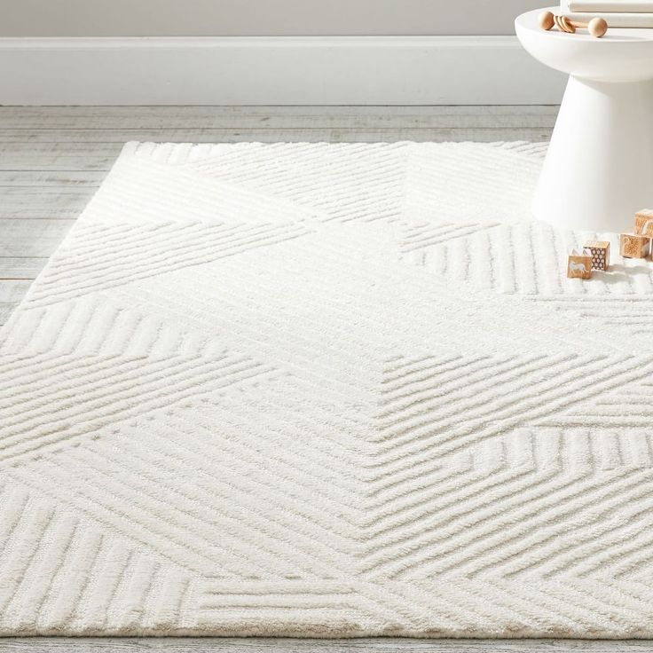 a bathroom with a white rug on the floor