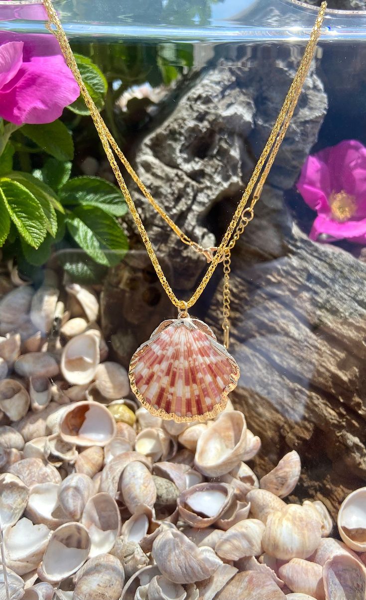 Handmade gold natural shell necklace. Its made with a real calico scallop shell on a gold plated chain. The chain is 16 inches long and can be adjusted as there is a chain exteneder on the end. Please note that shape, color, and size of the natural seashell charm will vary slightly since no two shells are the same  Care instruction: Please remove it before bathing or swimming. Avoid your jewelry touching chemical such as hairsprays or perfumes. Using soft cloth to clean your jewelry after wearing it, and store it in a dry and cool place. Shipping: After receiving you order processing time may take 1-3 working days. All the products will be sent via air registered mail / first class international with tracking number. Gold-tone Pendant Necklace For Gift, Plated Pendant Necklaces As Gifts, Plated Round Pendant Chain Necklace Gift, Plated Pendant Necklace For Gift, Gold-tone Clavicle Chain Necklace For Gift, Plated Chain Necklace With Round Pendant As Gift, Plated Round Pendant Necklace For Gift, Gift Round Pendant Necklace Plated, Gift Plated Round Pendant Necklace