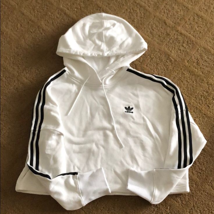 Cropped Hoodie 3 Striped Along Both Sleeves Great Condition Never Worn Adidas Sportswear Hoodie With Three Stripes, Adidas Sporty Hoodie With Ribbed Cuffs, Sporty Hoodie With Ribbed Cuffs For Spring, Sporty Spring Hoodie With Ribbed Cuffs, White Athleisure Hoodie With Three Stripes Branding, White Sporty Sweatshirt With Ribbed Cuffs, Trendy White Hoodie With Ribbed Cuffs, Sporty White Sweatshirt With Ribbed Cuffs, White Winter Sweatshirt With Three Stripes Branding