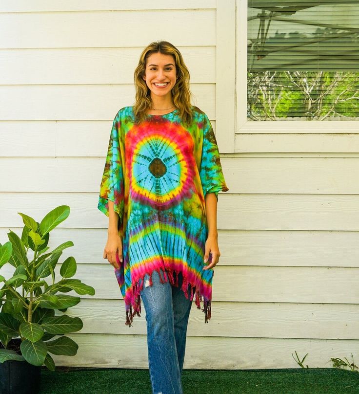 "Indulge in the unique charm of our hand-dyed tunic top, meticulously crafted for those who appreciate exceptional fashion. Made from 100% breathable and comfy rayon, this stunning piece is designed to elevate your style while ensuring absolute comfort. Our tunic top stands out with its one-of-a-kind hand-dyed method, guaranteeing that no two pieces are exactly alike. Embracing a loose silhouette, it offers a versatile fit that flatters a wide range of sizes, from S to 2XL. With its side-stitche Oversized Green Bohemian Tunic, Hippie Multicolor Poncho For Beach, Multicolor Hippie Beach Poncho, Bohemian Batik Print Tops For Vacation, Bohemian Hand Dyed Tops For Beach, Bohemian Tie Dye Tops For Vacation, Bohemian Tie-dye Tops For Vacation, Green Bohemian Top With Batik Print, Bohemian Tie Dye Batik Print Top