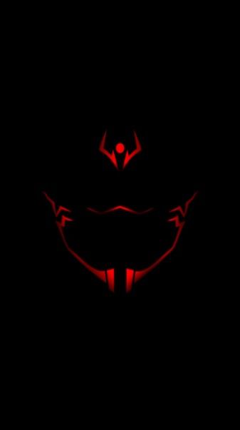 the dark background with red lights in the shape of a cat's head and fangs