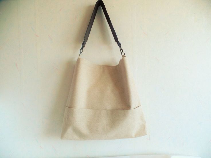 Linen bag, medium bucket bag, hobo slouchy bag purse, everyday casual shoulder bag in beautiful natural linen oatmeal light beige color with real leather strap in dark chocolate brown. * Exterior - Natural linen in beautiful shade of light beige color - Two outside exterior pockets *Interior - Cotton lining - Two inside interior pockets * Closes with magnetic snap button * Real leather strap from high quality italian genuine leather in gorgeous dark chocolate brown color. Reinforced with antique Everyday Bucket Bag With Double Handle And Pockets, Everyday Double Handle Hobo Bag With Pockets, Everyday Bucket Canvas Bag With Handles, Modern Everyday Hobo Bucket Bag, Modern Hobo Bucket Bag For Everyday, Large Capacity Hobo Bucket Bag For Everyday Use, Trendy Hobo Bag For Everyday Use, Large Capacity Everyday Crossbody Shoulder Bag, Everyday Satchel Shoulder Bag With Handles