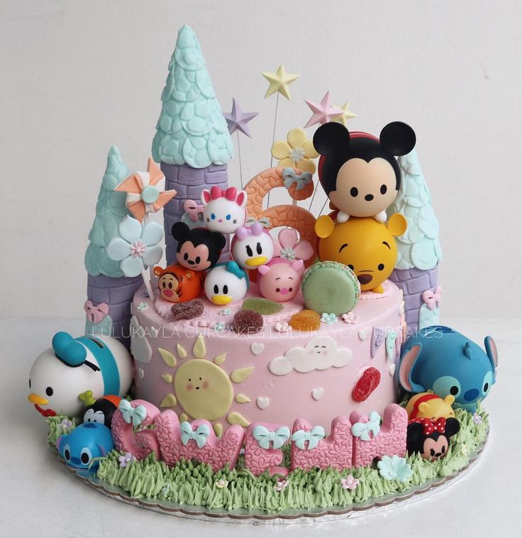 there is a cake decorated with many characters on it