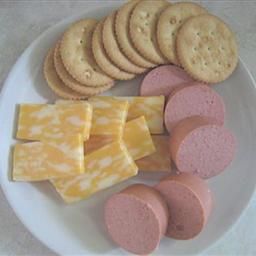 a white plate topped with crackers and cheese