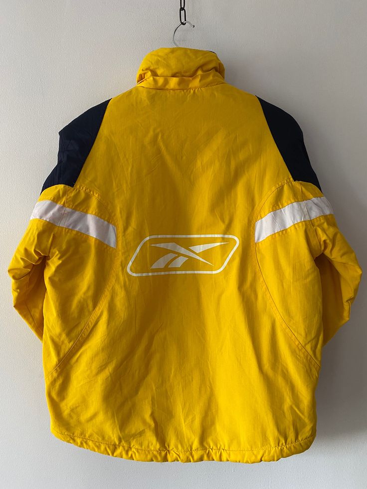 Vintage Yellow Winter REEBOK Puffer Jacket, unisex size kids 14-16 years, XS- S women Size:  XS-S women * PRODUCT SIZES: * - height                                   64cm  /  25.1 inch - sleeve                                   56 cm /  22.04 inch -shoulders                              48 cm   /  18.8 inch -armpit to armpit                   56 cm   /  22.04 inch Very good vintage condition. PLEASE PROVIDE YOUR PHONE NUMBER FOR FAST SHIPPING  ✈️        FAST SHIPPING with DHL EXPRESS! ☎️+ 💌 Provide phone no and email for DHL courier to have a smooth shipping. We deliver worldwide with DHL Express. ▪️ European countries         1-2 days ▪️ Canada/US/Japan/etc.    3-5 days  🟥  Returns & Exchange Policy We accept returns only after you receive the parcel and just in the case the item is not Sporty Windbreaker For Cold Weather, Casual Yellow Windproof Outerwear, Yellow Sportswear Outerwear For Fall, Functional Yellow Outerwear For Sports, Functional Yellow Sports Outerwear, Functional Yellow Outerwear For Winter, Functional Yellow Winter Outerwear, Yellow Functional Sports Outerwear, Sporty Yellow Windproof Outerwear