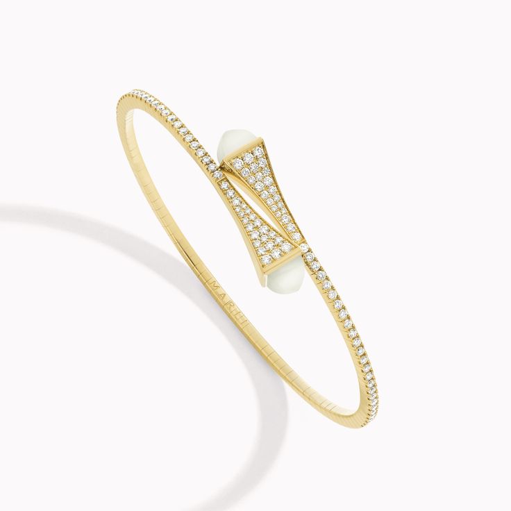 18 Karat Yellow Gold Midi Diamond Slip-On BraceletThis distinctive design features a bracelet crafted from 18K white, rose, or yellow gold, brilliant-cut diamonds, and capped with precious gemstones of your choice. It can be worn alone or layered with other pieces of the collection for a fashion-forward look. Cleo by Marli draws inspiration from Cleopatra, evoking her strength and power capturing enriching color and daring design. Modern White Bracelets With Diamond Accents, Luxury White Bracelet With Pave Setting, Fine Jewelry White Bangle With Single Cut Diamonds, Luxury White Pavé Setting Bracelet, White Bangle With Single Cut Diamonds, Modern White Diamond Bracelet With Single Cut Diamonds, Luxury White Diamond Jubilee Bracelet, Modern White Diamond Bangle Bracelet, White Luxury Jubilee Diamond Bracelet