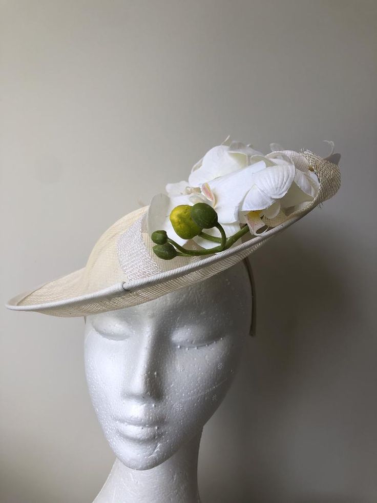 Cream/beige hatinator with loops and white orchids and | Etsy Spring Sinamay Fascinator Hat, Sinamay Fascinator Hat For Spring, Spring Sinamay Fascinator, Elegant Natural Boater Hat For Kentucky Derby, Elegant White Sinamay Fascinator, Spring Fascinator With Sinamay And Curved Brim, Cream Fitted Hat With Handmade Flowers, White Sinamay Mini Hats For Races, Fitted Cream Boater Hat For Beach