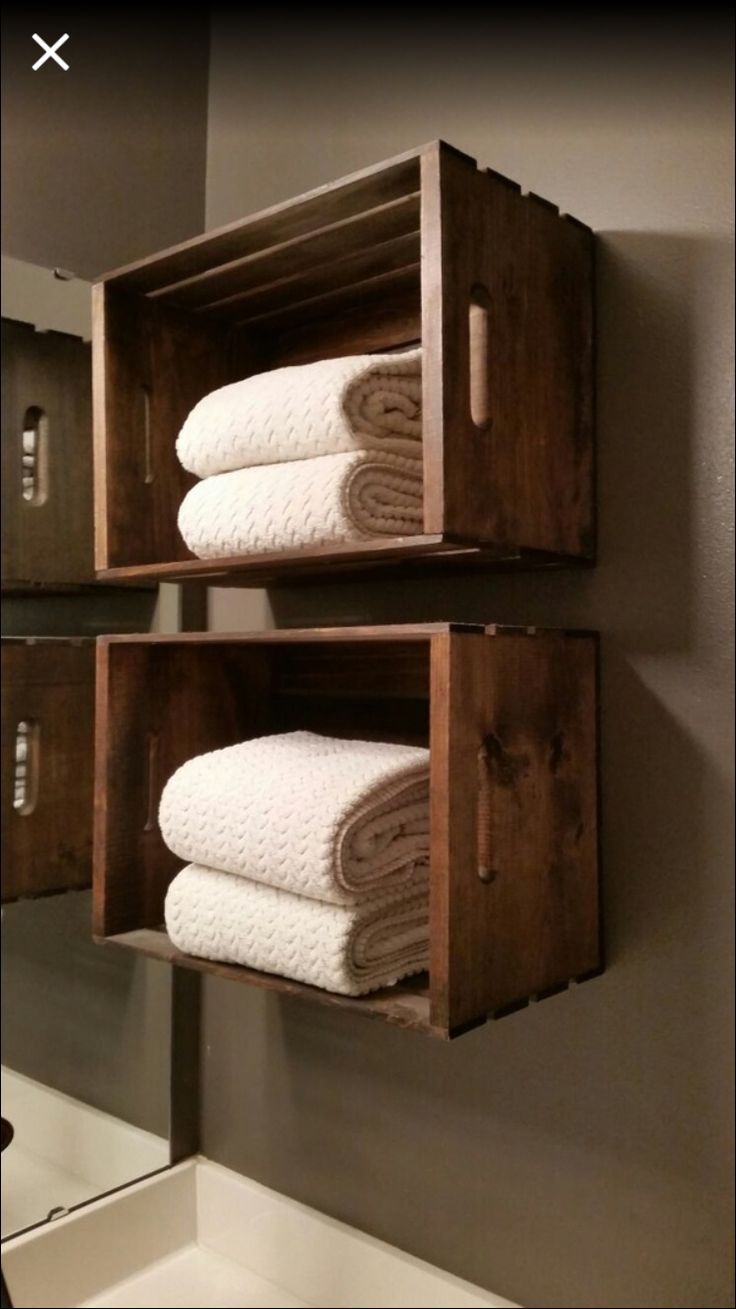 two wooden crates holding towels in the bathroom