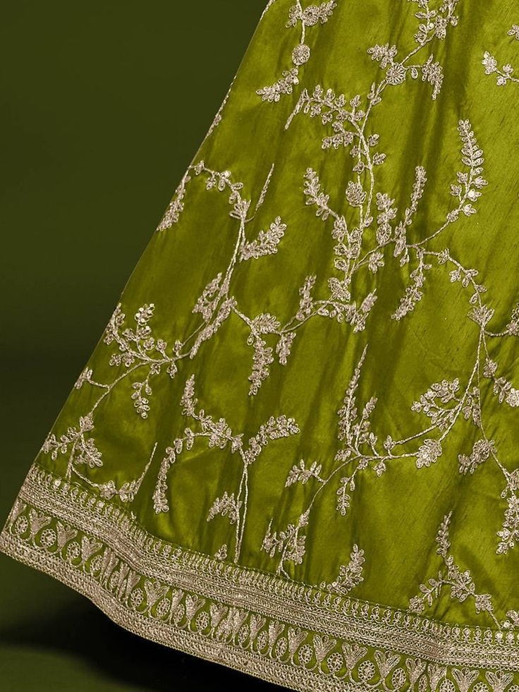 Breathe fresh life into your aspirations with this neon green marriage wear lehenga made of art silk material beautifully crafted with thread, zari embroidery, sequins work, and dori work all overcomes with attached can-can inside. Paired with similar choli material with embroidery lacework and net dupatta with four side lace and embroidery work. This designer lehenga is stitched and can be customized up to 42 inches and come with fully stitched choli material You can adorn this beautiful leheng Green Anarkali Sets With Intricate Embroidery, Green Saree Set With Intricate Embroidery, Pista Green Chanderi Choli With Intricate Embroidery, Semi-stitched Green Embroidered Fabric, Intricate Embroidered Pista Green Chanderi Choli, Green Art Silk Anarkali Set With Intricate Embroidery, Green Art Silk Choli With Intricate Embroidery, Unstitched Green Anarkali Set With Intricate Embroidery, Green Chanderi Choli With Intricate Embroidery