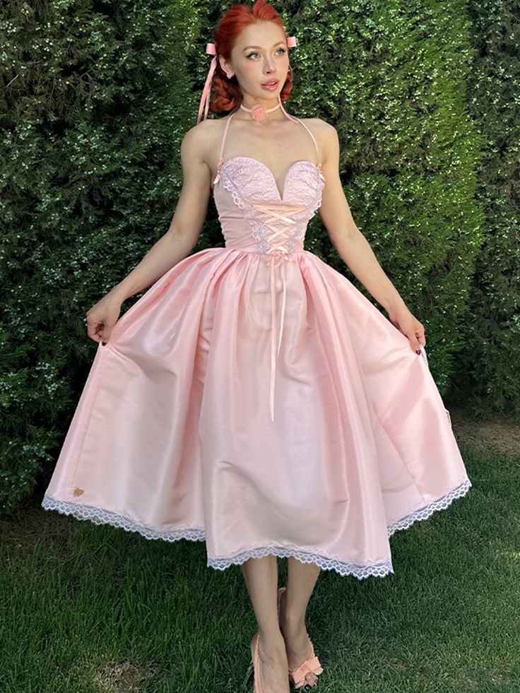 This enchanting dress features a delicate and flattering shade of pink with a pearl-like sheen. The bodice is structured with built-in boning to create a stunning, three-dimensional bust shape. Below the bust, the adjustable sash not only serves as a decorative element but also allows for a customizable fit around the waist. The voluminous skirt is adorned with an entire circle of lace trim, adding a touch of vintage charm while imparting a youthful look. Embrace the timeless elegance of Lolita Spring A-line Corset Dress With Fitted Bodice, Fitted Pink Corset Dress For Summer, Spring A-line Corset Dress With Corset Back, Pink Corset Dress With Sweetheart Neckline For Summer, Spring Sleeveless Pink Corset Dress, Pink Sleeveless Corset Dress For Spring, Princess Style Satin Dress With Fitted Bodice, Elegant Pink Overbust Dress, Feminine Spring Corset Dress With Fitted Bodice