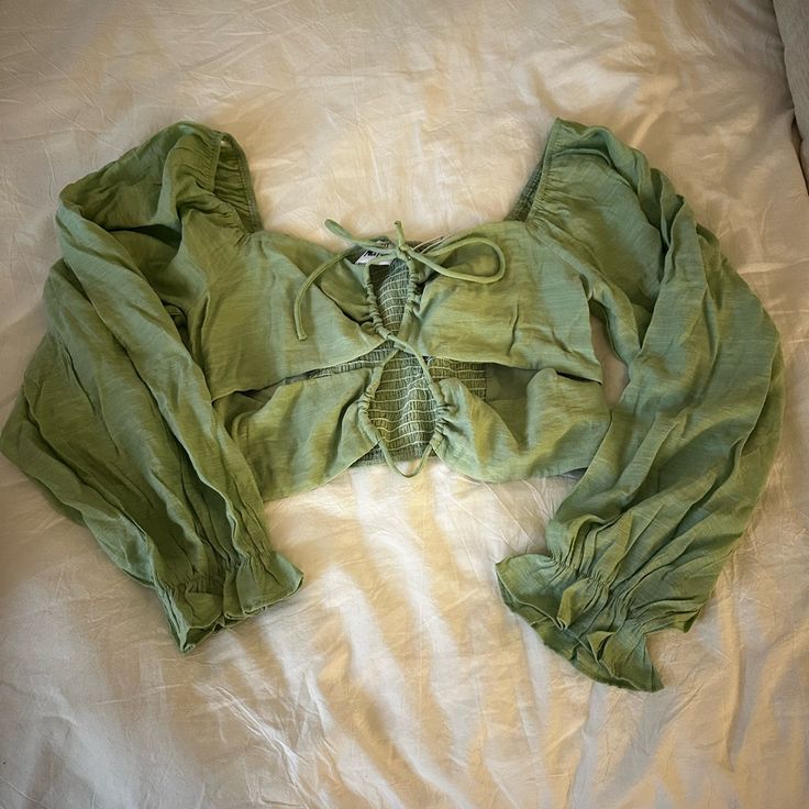 Never Worn, Still Has Tags, From Princess Polly, Ties In The Front, Long Sleeve Crop Top, Pretty Light Green Color, Size Us 10 Green Long Sleeve Crop Top For Day Out, Casual Green Long Sleeve Crop Top, Green Long Sleeve Summer Top, Stretch Cotton Green Blouse, Green Crop Top For Fall Day Out, Summer Stretch Top With Long Sleeves, Summer Stretch Tops With Long Sleeves, Green Cropped Cotton Blouse, Green Cotton Crop Top For Spring