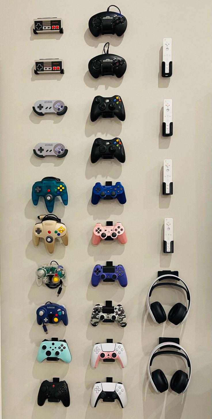 there are many video game controllers hanging on the wall