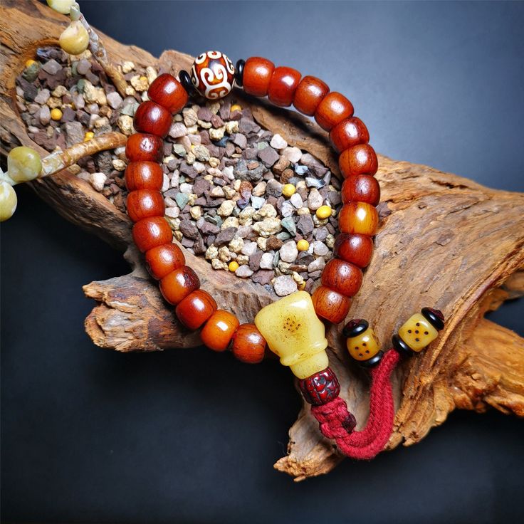 ❤This bone mala bracelet was made by Tibetan craftsmen and come from Hepo Town, Baiyu County, the birthplace of the famous Tibetan handicrafts. Its circumference is 20cm, 24 beads in round, including 23 brown yak bone beads with a diameter of 11mm, a cloud dzi bead with a diameter of 14mm, a yak bone guru bead with a length of 22mm, and 2 yak bone dice hanging from the tail. ❤These amazing bone beads are handcrafted by artisans from Tibet,who recycle and reuse everything in daily life and spirit Beads Bracelet For Men, Tibetan Yak, Lotus Sutra, Prayer Bead Bracelet, Nothing Is Permanent, Buddhist Teachings, Wrist Mala, Om Mani Padme Hum, Tibetan Buddhism