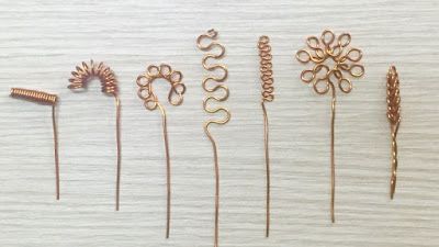 several different types of hair pins on a table