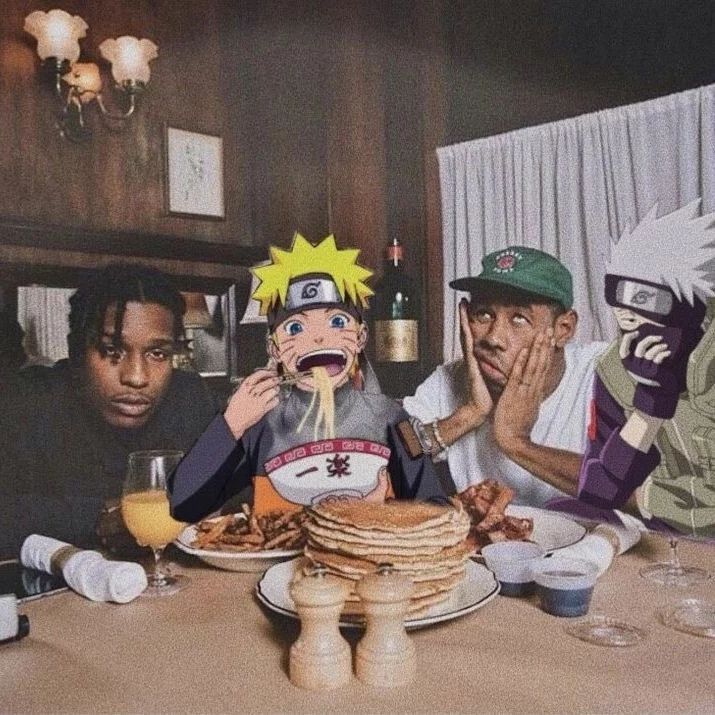 three men sitting at a table with plates of food and drinks in front of them