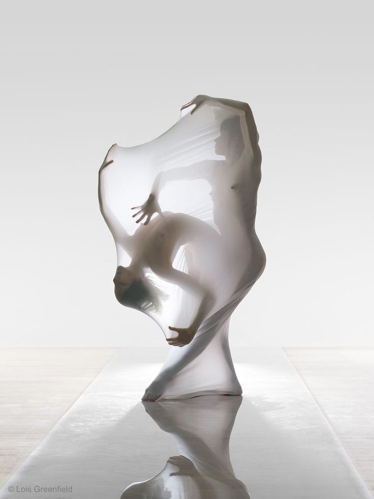 a glass sculpture sitting on top of a table