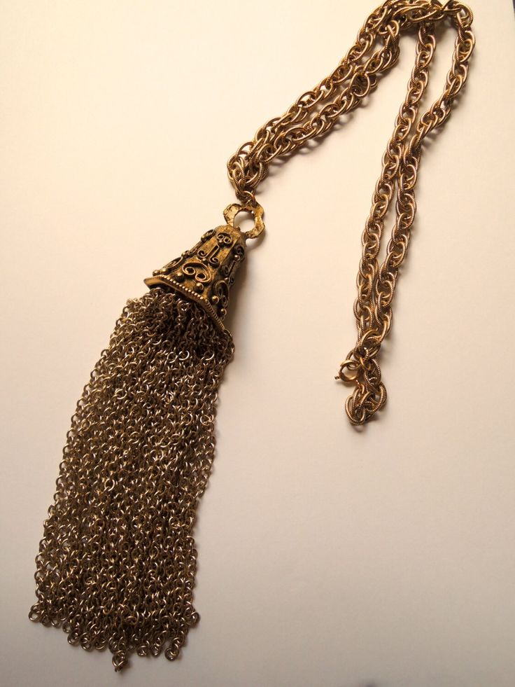 Vintage costume jewelry chained necklace with unique design. Weighs a few ounces. circa 1960. Formal Costume Jewelry Chain Necklaces, Evening Costume Jewelry Necklace With Chain, Metal Chain Necklaces For Evening, Evening Metal Chain Necklaces, Metal Chain Necklace For Evening, Vintage Jewelry With Adjustable Chain For Party, Evening Metal Necklace With Gold Chain, Vintage Party Jewelry With Adjustable Chain, Metal Costume Jewelry Chain Necklace