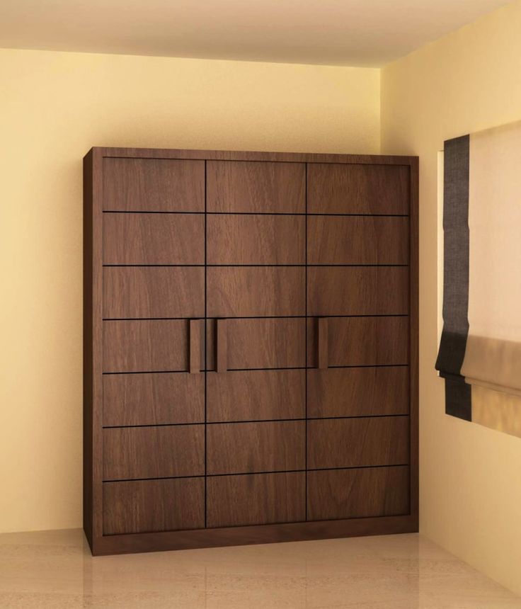 a large wooden cabinet sitting in the corner of a room