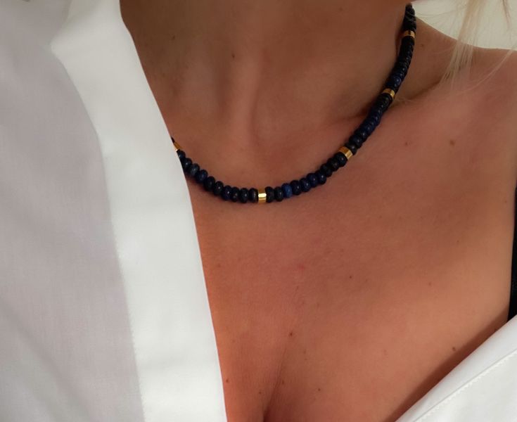 Handcrafted by IJ Design Boutique 🤍🌟 Made in Uk Made of: * Genuine raw Lapis Lazuli gemstone  * 14k gold filled pendant and details * Stainless steel  * Anti-allergenic * Long lasting * Heavy  Length 42 cm +4cm adjustable  Closure: Lobster clasps  -IJ DESIGN BOUTIQUE- From necklaces to earrings, we make jewellery using a wide range of materials. From silver and gold plated to freshwater pearls and real gemstones.  Our collections are all based on the latest trends in jewellery along with class Lapis Lazuli Beaded Necklaces For Gift, Single Strand Lapis Lazuli Beaded Necklace As Gift, Handmade Lapis Lazuli Necklaces, Gold Choker With Gemstone Beads As Gift, Gold Choker With Gemstone Beads For Gift, Elegant Adjustable Lapis Lazuli Beaded Necklace, Handmade Elegant Lapis Lazuli Beaded Necklaces, Handmade Minimalist Lapis Lazuli Jewelry, Handmade Lapis Lazuli Necklace Gift