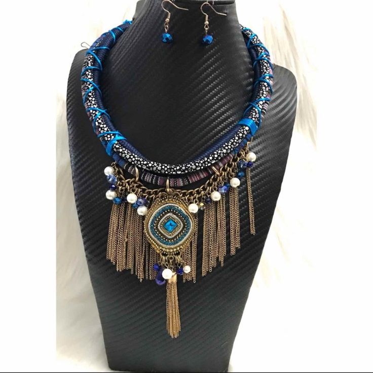 Multi Color Blue Tribal Style Rope Necklace With Chain Fringe. Includes Matching Earrings. Approx. 22” Chain Length With 6” Fringe. New Without Tags As I Purchased This And Never Wore It. Blue Dangle Jewelry With Adjustable Chain, Blue Bohemian Necklaces For Party, Blue Beaded Jewelry Sets For Party, Blue Metal Jewelry With Dangling Beads, Blue Beaded Jewelry Sets For Gift, Blue Metal Jewelry Sets, Blue Metal Jewelry With Adjustable Chain, Blue Chain Costume Jewelry, Blue Costume Jewelry With Chain