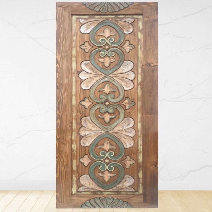 a wooden door with an ornate design on it