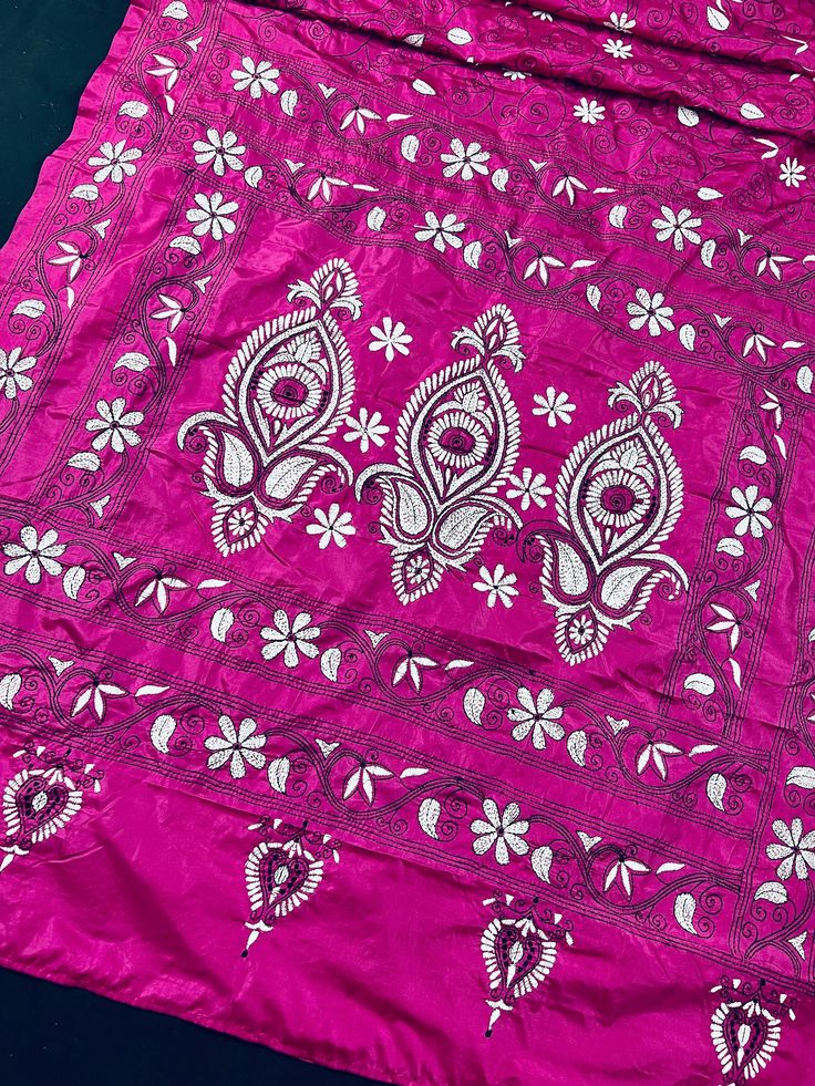 Gorgeous Magenta Pink color saree with handwoven Kantha stitch work in Black and White color. Please note - The edging on the pallu end is done by the weaver with the same kantha stitch work and not done with machine. Item: Saree Color : Magenta Pink, White and Black. Base Fabric: Bangalori Silk Blouse piece : Yes Blouse material: Bangalori Silk Work: Handloom, Kantha Work Fall & Edging (Yes/No) : Yes Occasion: Party, Festival, Traditional, Religious, House-warming. Disclaimer -: - Color variati Embroidered Silk Pre-draped Saree For Puja, Festival Banarasi Silk Pre-draped Saree With Chikankari Embroidery, Navratri Silk Choli With Chikankari Embroidery, Pink Pre-draped Saree With Motifs, Festival Pre-draped Saree With Chikankari In Dola Silk, Festival Raw Silk Pre-draped Saree With Chikankari Embroidery, Chikankari Embroidered Art Silk Traditional Wear For Puja, Art Silk Traditional Wear With Chikankari Embroidery For Puja, Art Silk Traditional Wear For Puja With Chikankari Embroidery