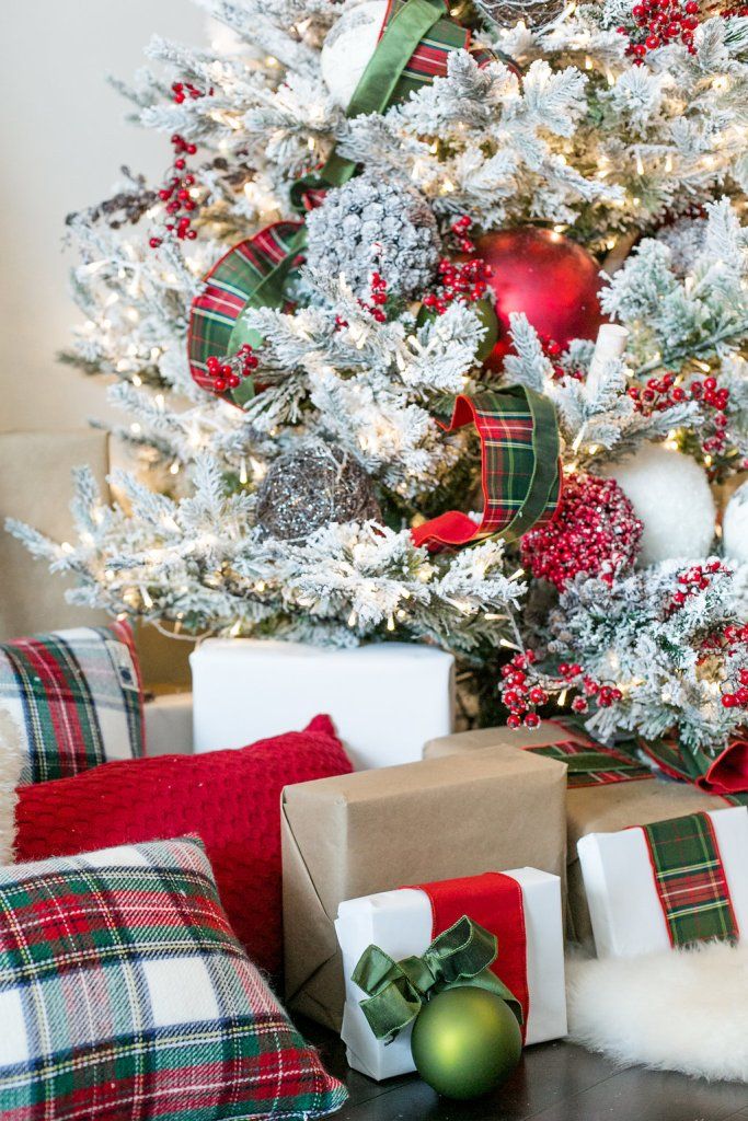 a christmas tree with presents under it