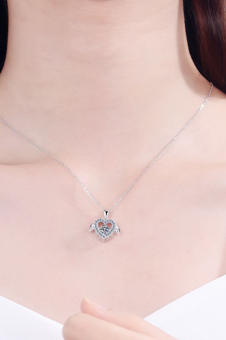 This quirky Moissanite Sterling Silver Necklace is a must-have for any jewelry collection. Made with a stunning necklace design, it's perfect for adding a touch of playful sophistication to any outfit. With its sparkling moissanite gemstone, this necklace will make you stand out in a crowd. Includes: A matching box. Moissanite jewelry over 0.3 carats includes a certificate of stone properties. Limited warranty included, please contact us for any issues related to your purchase. Material: 925 ste Elegant Heart Shaped Crystal Clavicle Necklace, Elegant Heart-shaped Crystal Necklace, Elegant Mother's Day Pendant Crystal Necklace, Cubic Zirconia Pendant Heart Necklace For Her, Cubic Zirconia Heart Pendant Necklace As Gift For Her, Cubic Zirconia Gemstone Heart Pendant Necklace, Diamond White Necklace With Detachable Pendant, Dainty Diamond White Gemstone Necklace, Crystal Heart Pendant Jewelry For Her