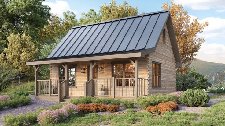 a small wooden cabin with a metal roof