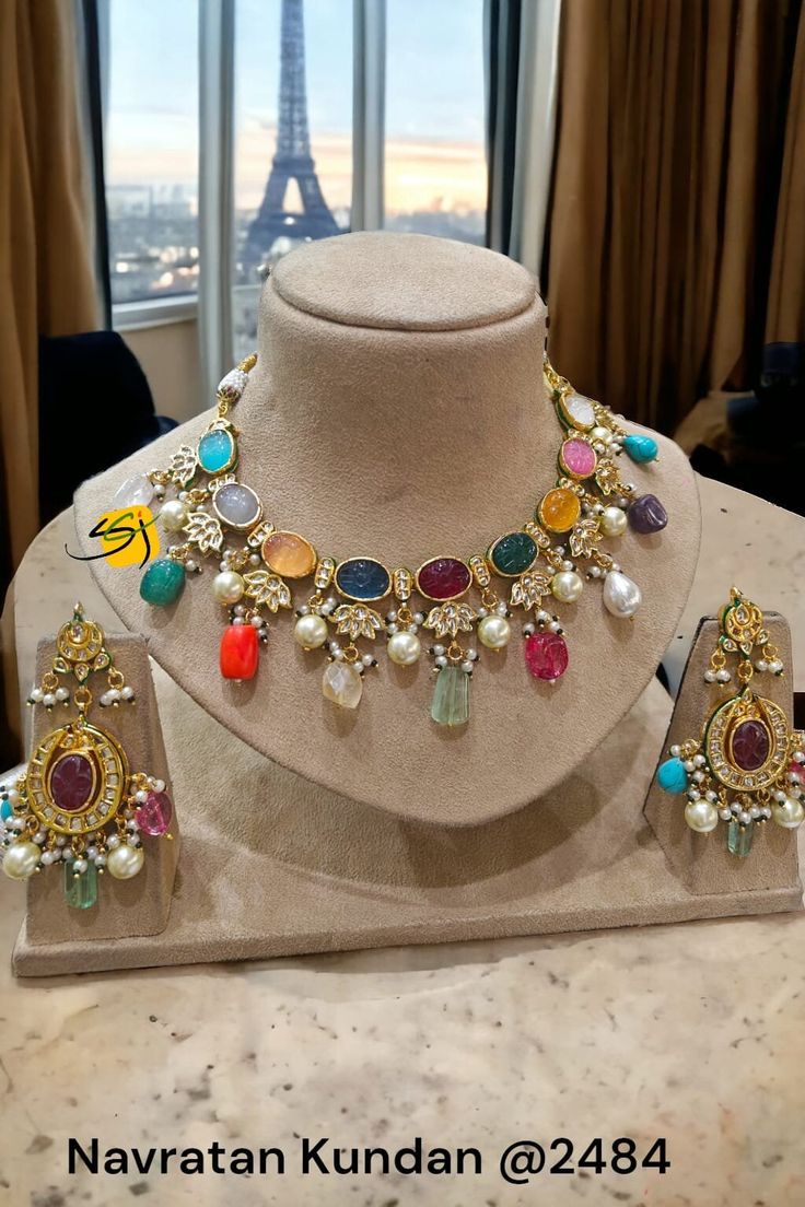 Premium Sabyasachi Inspired Matt Dull Gold Plated Ruby Red MultiColor Navratan Kundan Polki Zirconium Diamond Necklace Set Kundan Necklace Elevate your ethnic ensemble with our exquisite Jadau Navratan Kundan Long Necklace, a true symbol of timeless beauty and elegance. Handcrafted with precision and attention to detail, this stunning necklace features intricate jadau work adorned with colorful navratan stones and dazzling kundan accents. Each element of this necklace is meticulously crafted to Luxury Jewelry For Puja And Navratri, Fusion Multicolor Jewelry Sets For Diwali, Fusion Style Multicolor Jewelry Sets For Diwali, Fusion Style Multicolor Jewelry Sets, Multicolor Fusion Kundan Necklace With Tilla, Festive Multicolor Kundan Necklace With Latkans, Multicolor Fusion Bridal Necklace For Diwali, Elegant Multicolor Necklace For Festivals, Elegant Multicolor Necklaces For Festivals