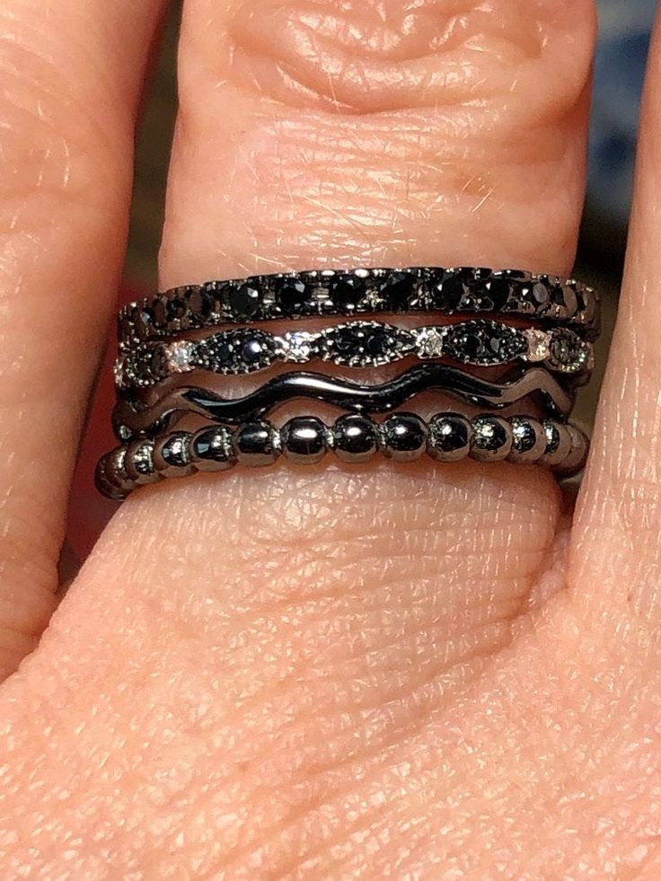 Looking for something unique and one-of-a-kind? This is one of my favorite stacking sets. Natural black sapphires and black spinel with black rhodium and sterling silver create a premium design effect. Gorgeous combination for wedding bands or engagement options. A great cosmos and earthy theme. This set is a size 7, but we can arrange other sizing if you would like? Elegant Black Bands Suitable For Gifts, Elegant Black Bands For Gifts, Black Spinel Jewelry For Anniversary, Fine Jewelry Stackable Black Diamond Rings, Elegant Stackable Black Rings, Black Stackable Rings Fine Jewelry, Fine Jewelry Black Stackable Rings, Black Stackable Fine Jewelry Rings, Elegant Black Bands For Anniversary