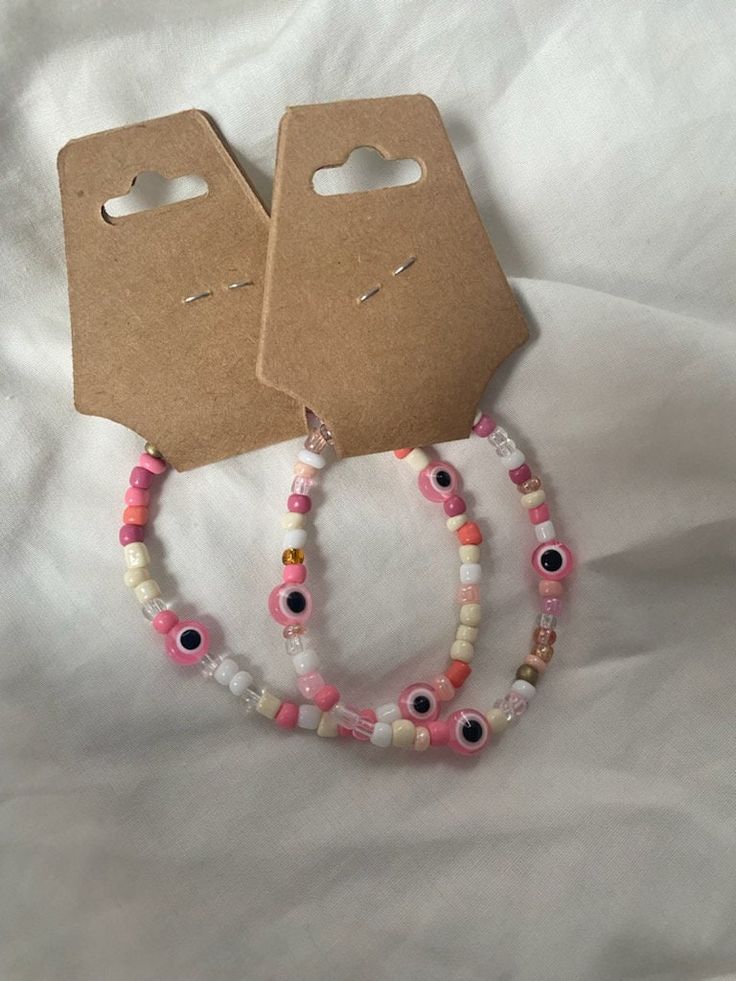 pink evil eye bracelet 🍀 ...meaning behind pink evil eye bracelet: Protect your friendships; Calming feeling; Content and relaxation. Evil Eye Bracelet Meaning, Eye Bracelet Meaning, Aesthetic Evil Eye, Feeling Content, Bracelet Meaning, Bracelets Aesthetic, Pink Evil Eye, Eye Bracelet, Evil Eye Bracelet