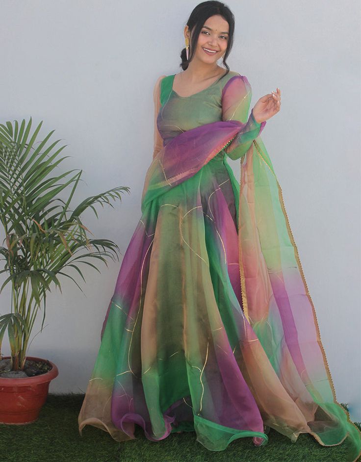 Designer Party Wear Heavy Readymade Gown With Dupatta Collection Processing Time : 20-25 Business Days Work : Digital Print & Hand Work Fabric:Top : Organza Tabby Silk Dupatta : Organza Silk Color:Top : Green Dupatta : Green Note : Properly care for your clothing by following care instructions Fitted Multicolor Floor-length Anarkali Set, Green Organza Dress For Reception, Multicolor Floor-length Party Dress, Purple Maxi Dress For Wedding Party Season, Green Semi-stitched Maxi Length Choli, Green Organza Party Gown, Festive Green Maxi Length Choli, Multicolor Dress With Sheer Dupatta For Festive Occasions, Green Floor-length Organza Choli