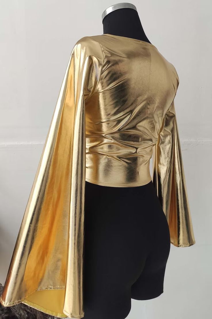 Gold Bell Sleeve Top Women's Wrap Front Tie Crop Top in - Etsy Metallic Fitted Tops For Party, Fitted Metallic Tops For Party, Chic Wrap Blouse For Party, Spring Party Long Sleeve Wrap Top, Long Sleeve Wrap Top For Spring Party, Metallic Fitted V-neck Top, Chic Long Sleeve Wrap Top For Party, Gold Stretch Crop Top For Party, Party V-neck Blouse With Faux Wrap