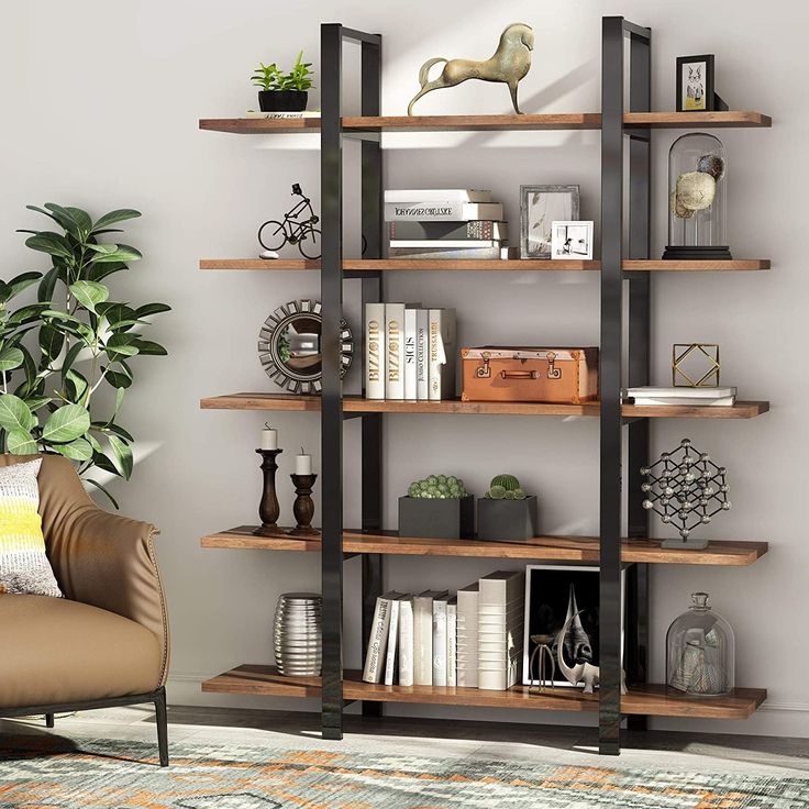 a book shelf with books and plants on it next to a dining room table in front of a window