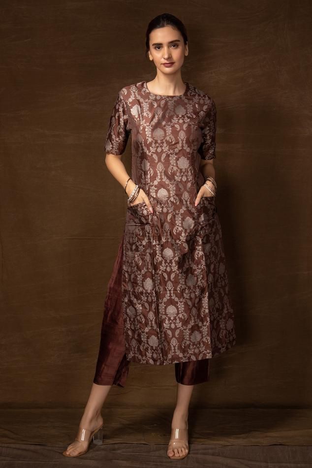 Brown banarasi silk kurta with floral pattern and side pockets. Comes with pant.
Components: 2
Type Of Work: Floral
Neckline: Round
Sleeve Type: Half
Fabric: Banarasi silk
Color: Brown
Other Details: 
Side slits on kurta
Occasion: Sangeet - Aza Fashions Tissue Kurta Design, Round Neck Embroidery Designs For Kurtis, Banaras Suit, Banarsi Suit Design Latest, Khatwork Kurti, Saree Upcycle, Banarasi Suit Designs, Satin Kurta, Honey Suckle