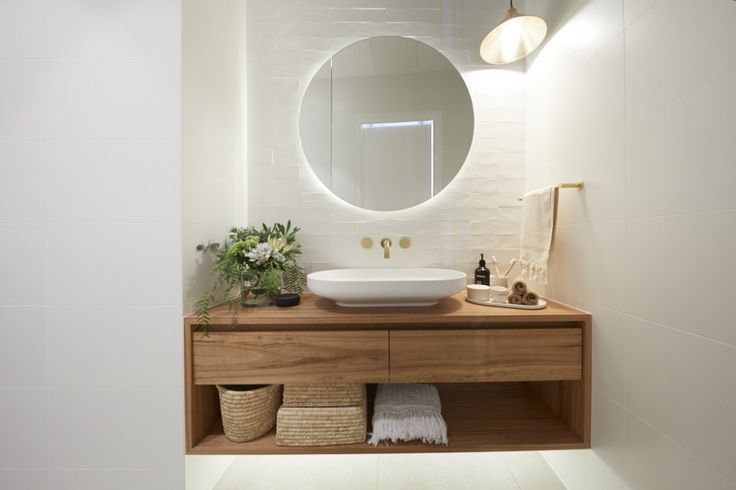 there is a sink and mirror in the bathroom