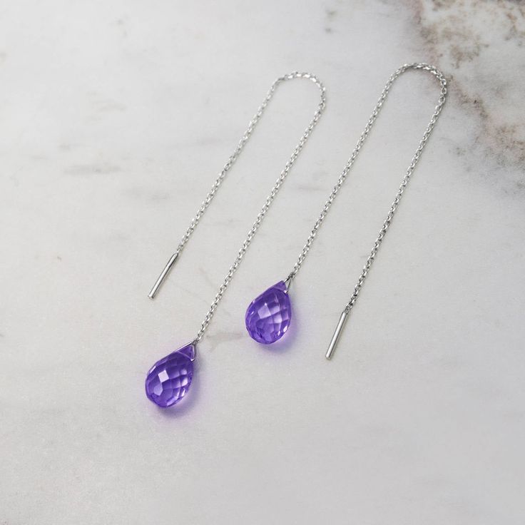 "\"A gold pair of threader earrings with a beautiful purple amethyst! February's birthstone is believed to bring warmth and strength to the person wearing it. They would make a unique birthstone gift for someone you love. Light and easy to wear all day long! Are they for you? Perfect! Simple and sophisticated, these earrings are aiming to make your day stable and peaceful!\" --Fairy Goldcharm ♥♥ CUSTOMIZATION ---> Available in yellow, white, or rose gold. ---> Isn't amethyst your birthston Silver 14k Gold Threader Earrings As Gift, Silver Briolette Earrings With Birthstone, Elegant Long Drop Purple Jewelry, Elegant Purple Long Drop Jewelry, Purple Long Drop Earrings As Gift, Purple Briolette Fine Jewelry Earrings, Minimalist Purple Drop Earrings, Hypoallergenic Briolette Earrings As A Gift, Hypoallergenic Briolette Earrings For Gift