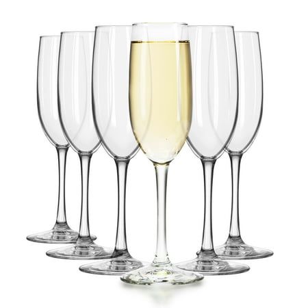 six wine glasses with different types of champagne