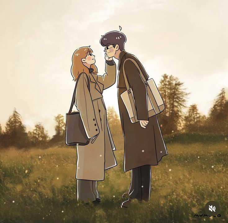 two people standing in the grass with trees in the background and one person wearing a brown coat