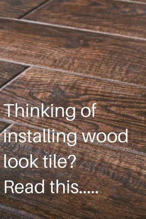 a wooden floor with the words thinking of installing wood look tile read this on it