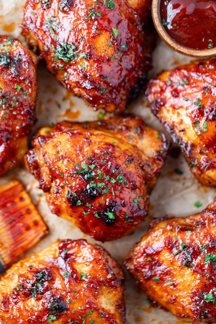 chicken wings covered in bbq sauce and garnished with parsley